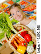 Lady showing basket full of fruit and vegetables. Стоковое фото, агентство Ingram Publishing / Фотобанк Лори