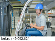 Man drving forklift. Стоковое фото, агентство Ingram Publishing / Фотобанк Лори