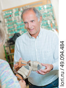 cobbler assessing shoe. Стоковое фото, агентство Ingram Publishing / Фотобанк Лори