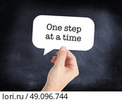 One step at a time written on a speechbubble. Стоковое фото, агентство Ingram Publishing / Фотобанк Лори