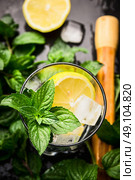 Glass with mint, lemon and ice cubes , top view, close up. Стоковое фото, агентство Ingram Publishing / Фотобанк Лори