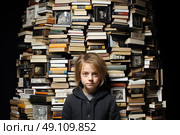 Curiosity Unleashed: A Young Girl Engrossed in Knowledge, Surrounded by a Towering Stack of Books. Стоковое AI-изображение, AI-художник Данила Большаков / Фотобанк Лори
