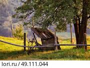September rural scene in Carpathian mountains. Authentic village and fence. Стоковое фото, агентство Ingram Publishing / Фотобанк Лори