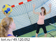 Goal keeper defending handball net. Стоковое фото, агентство Ingram Publishing / Фотобанк Лори