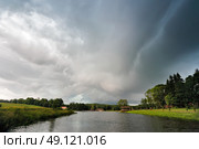 Summer storm landscape. Dramatic cloudy sky. Hurricane and rain in Belarus. Стоковое фото, агентство Ingram Publishing / Фотобанк Лори