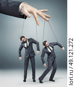 Conceptual picture of controlled employees. Стоковое фото, агентство Ingram Publishing / Фотобанк Лори