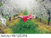 Majestic slim nymph levitating in the colorful orchard. Стоковое фото, агентство Ingram Publishing / Фотобанк Лори