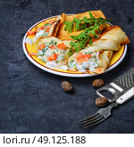 Pancakes for Shrove Tuesday. Tasty pancakes stuffed with meat and mushrooms on the plate. Стоковое фото, агентство Ingram Publishing / Фотобанк Лори