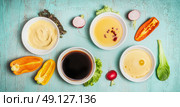 Healthy salad dressing ingredients in bowls: balsamic, mustard,olive oil and honey, top view. Diet eating, Vegetarian or vegan food concept. Стоковое фото, агентство Ingram Publishing / Фотобанк Лори