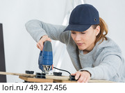using a wood stapler. Стоковое фото, агентство Ingram Publishing / Фотобанк Лори