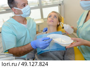 Nervous lady in dentist's chair. Стоковое фото, агентство Ingram Publishing / Фотобанк Лори