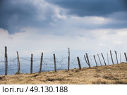 Fencing in the rugged Pyrenean mountains. Стоковое фото, агентство Ingram Publishing / Фотобанк Лори