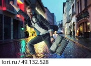 Successful businessman making a victorious gesture. Стоковое фото, агентство Ingram Publishing / Фотобанк Лори