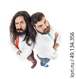 Two nerdy men posing in office. Стоковое фото, агентство Ingram Publishing / Фотобанк Лори