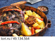 Roast mutton in the pan. Mutton cooked in a pan with potatoes and vegetables. Стоковое фото, агентство Ingram Publishing / Фотобанк Лори