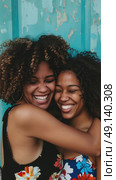 Two women embrace each other warmly in front of a blue wall. Стоковое AI-изображение, AI-художник Данила Большаков / Фотобанк Лори