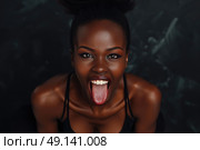 A woman playfully sticks out her tongue in a humorous gesture. Стоковое AI-изображение, AI-художник Данила Большаков / Фотобанк Лори