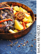 Roast lamb in the pan. Mutton meat cooked in pan with potatoes and pepper. Стоковое фото, агентство Ingram Publishing / Фотобанк Лори