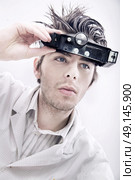 Young, handsome technician thinking about issue solution. Стоковое фото, агентство Ingram Publishing / Фотобанк Лори