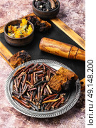 gathering roots and herb. Medicinal herbs and root, comfrey, inonotus obliquus and calendula. Стоковое фото, агентство Ingram Publishing / Фотобанк Лори