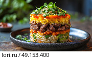 A vibrant and multilayered rice dish accompanied by succulent grilled meat and an assortment of fresh herbs. Стоковое AI-изображение, AI-художник Anastasy Yarmolovich / Фотобанк Лори