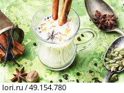 Masala tea ingredients. glass of Indian tonic tea with milk and spicy spices. Стоковое фото, агентство Ingram Publishing / Фотобанк Лори