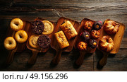 Pastries in a row Croissant Muffin Cookie Bagel and Neapolitan bakery. Стоковое фото, агентство Ingram Publishing / Фотобанк Лори