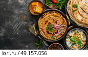 Homemade Kerala wheat paratha or layered parotta served with Paneer curry. Стоковое AI-изображение, AI-художник Anastasy Yarmolovich / Фотобанк Лори
