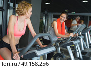 girl exercising at the gym on stepper machine. Стоковое фото, агентство Ingram Publishing / Фотобанк Лори