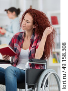 woman in wheelchair. Стоковое фото, агентство Ingram Publishing / Фотобанк Лори