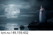 Elven girl on night sea coast. Стоковое фото, агентство Ingram Publishing / Фотобанк Лори