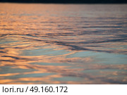 Surface of the water on the Lake at dusk, Lake of The Woods, Ontario, Canada. Стоковое фото, агентство Ingram Publishing / Фотобанк Лори