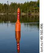 Navigational buoy in the lake, Lake Of The Woods, Ontario, Canada. Стоковое фото, агентство Ingram Publishing / Фотобанк Лори