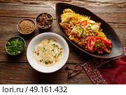 Chicken Biryani indian recipe with white soup and spices. Стоковое фото, агентство Ingram Publishing / Фотобанк Лори