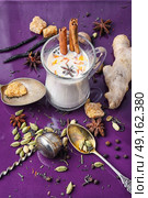 Masala tea ingredients. glass of Indian tea with milk and spicy spices. Стоковое фото, агентство Ingram Publishing / Фотобанк Лори