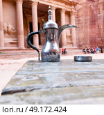 in the site of petra jordan the traditional coffe container isolated on a table. Стоковое фото, агентство Ingram Publishing / Фотобанк Лори