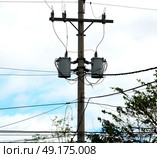 blur  in  philippines   a electric pole with transformer and wire  the cloudy sky. Стоковое фото, агентство Ingram Publishing / Фотобанк Лори