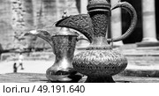 in the site of petra jordan the traditional coffe container isolated on a table. Стоковое фото, агентство Ingram Publishing / Фотобанк Лори