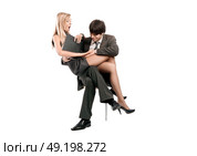 Domineering boss molesting his attractive secretary. Стоковое фото, агентство Ingram Publishing / Фотобанк Лори