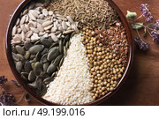 Spices and herbs in ceramic bowl. seasoning. Colorful natural additives. Стоковое фото, агентство Ingram Publishing / Фотобанк Лори
