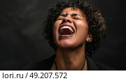 A woman with her mouth wide open, showing a surprised or shocked expression. Стоковое AI-изображение, AI-художник Данила Большаков / Фотобанк Лори