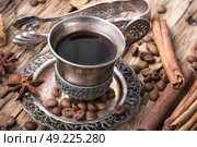 Coffee mug in the oriental style. Vintage set with cup of coffee on saucer in oriental style. Стоковое фото, агентство Ingram Publishing / Фотобанк Лори