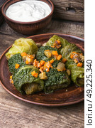 Cabbage rolls stuffed vegetable,. Ukrainian vegetable dietary cabbage rolls in leaf of savoy cabbage. Стоковое фото, агентство Ingram Publishing / Фотобанк Лори