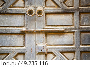 morocco knocker in africa the old wood  facade home and rusty safe padlock . Стоковое фото, агентство Ingram Publishing / Фотобанк Лори