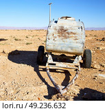 water tank in morocco africa land gray  metal weel and arid. Стоковое фото, агентство Ingram Publishing / Фотобанк Лори