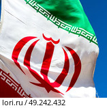 in iran blur  iranian waving flag  the blue sky and wind. Стоковое фото, агентство Ingram Publishing / Фотобанк Лори
