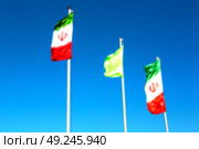 in iran blur  iranian waving flag  the blue sky and wind. Стоковое фото, агентство Ingram Publishing / Фотобанк Лори