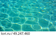 The water in the pool is illuminated by the sun. Cool water in a concrete-covered pond. Стоковое AI-изображение, AI-художник Антон Слабоспицкий / Фотобанк Лори