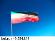 in iran blur  iranian waving flag  the blue sky and wind. Стоковое фото, агентство Ingram Publishing / Фотобанк Лори