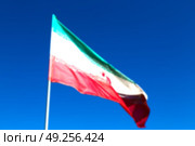 in iran blur  iranian waving flag  the blue sky and wind. Стоковое фото, агентство Ingram Publishing / Фотобанк Лори